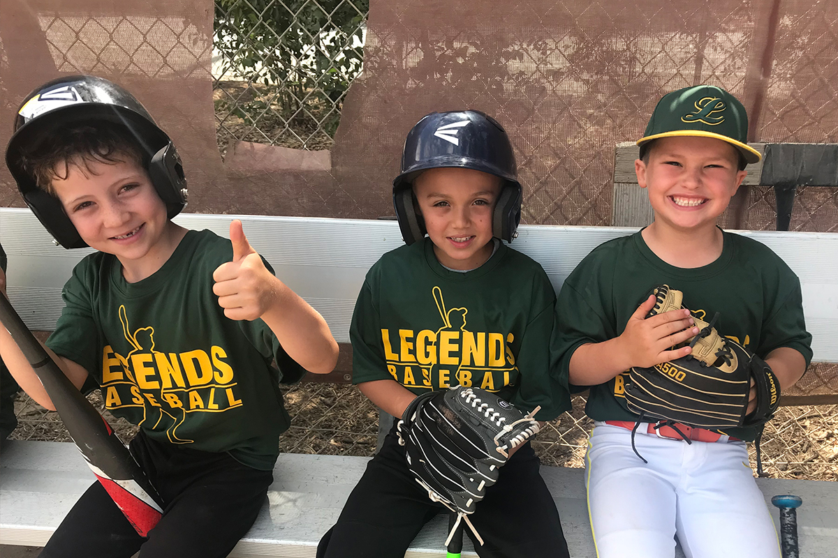 Legends Baseball players encouraging each other